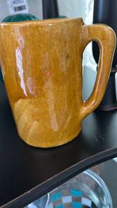 lot 40303 image: Handcrafted Orange Ceramic Coffee Mug with Makers Mark