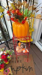 lot 40315 image: Red Metal Two-Tier Plant Stand with Fall Pumpkin and Floral Display