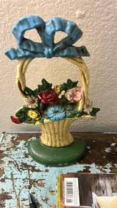 lot 40346 image: Cast Iron Flower Basket Doorstop with Blue Ribbon