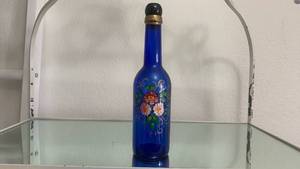 lot 40137 image: Hand Painted Blue Glass Bottle with Floral Design