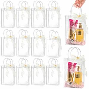 lot 6021 image: Ohuimrt 20 PCS Clear Plastic Gift Bags with Handles, 6.3 x 9.84 x 3.15 Inches Reusable Party Favor Bags with Ribbon Transparent Gift Wrap Bags Bulk for Weddings Birthdays