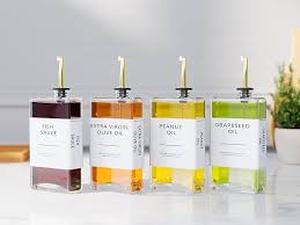 lot 1600 image: New England Stories 4 Pack Glass Cooking Oil Dispensers Set