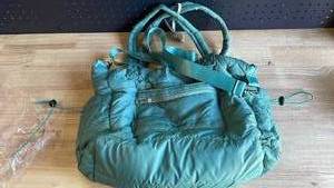 lot 19402 image: Green Down Carry Bag with Straps