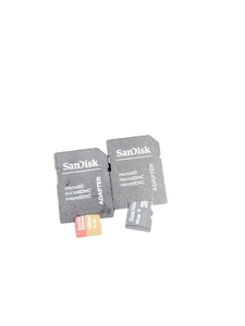 lot 6108 image: SanDisk microSD adapters one with 128 GB micro SD and the other with a 16 GB Micro SD