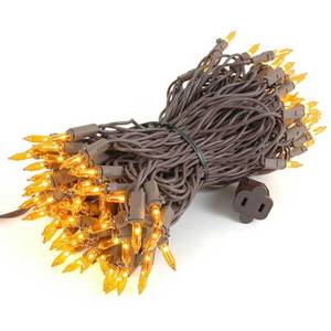 lot 20304 image: Novelty Lights 50 Feet 100 Bulbs Traditional Incandescent Mini Lights, Amber on Brown Wire with 6 Spacing, Commercial Grade and UL Listed for IndoorOutdoor Use, End-to-End Connectable