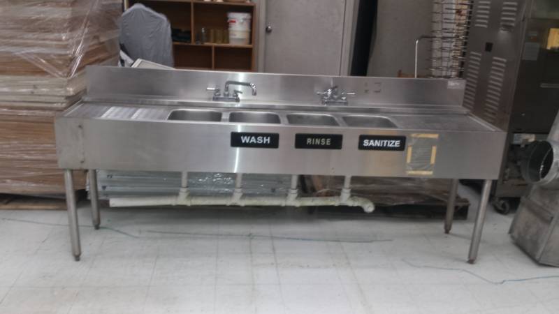 lot 1133 image: 7ft SS Bar Sick w Four Bay Sink, 2 Faucets, Drain Boards and Drain Pipes