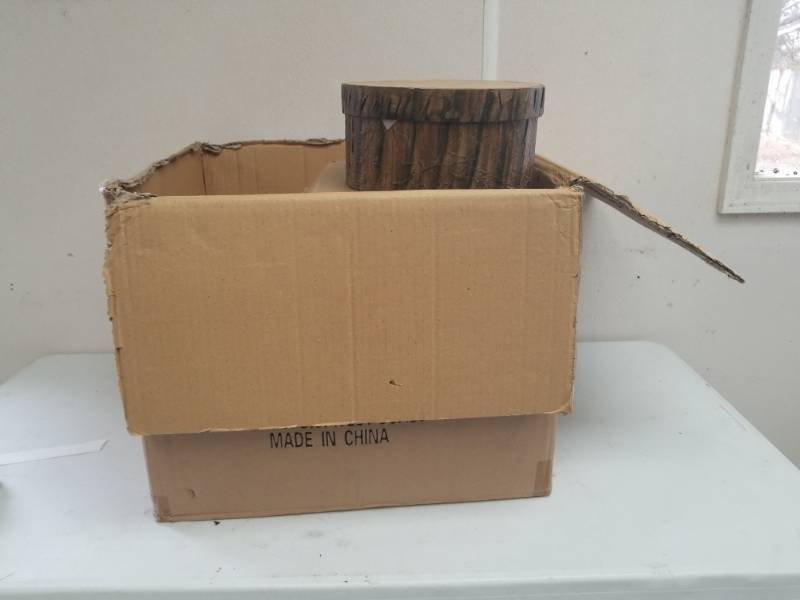 lot 7582 image: Case of Round Boxes that Look Like Pieces of Wood with Lids