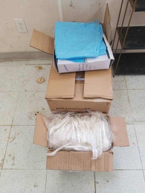 lot 7621 image: Case of Isolation Gowns and Case Plastic Indiv. Wrpd Forks