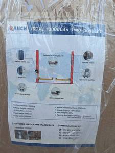 lot 5299 image: Unused 2025 IR TPL (1) Two Post Car Lift 10,000 LBS (Red)