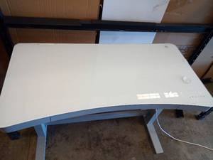 lot 1010 image: Electric Height Adjustable Standing Desk with USB Ports and glass top, tested up and down and works well. - Retail $299