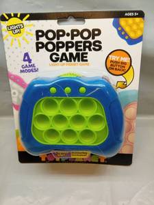 lot 1210 image: Pop Pop Poppers Light-Up Fidget Game - Retail $12