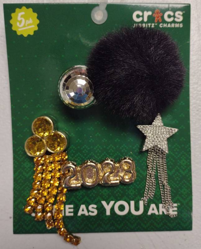 lot 203 image: Crocs Jibbitz 2023 New Year Charm Set