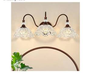 lot 61784 image: Antique Red Bronze Finish Bathroom Vanity Light, 3-Light Vintage Vanity Light with Floral Clear Glass Shades, Retro Wall Mount Lighting for Bathroom, Dressing Table - Retail $130