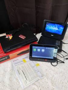 lot 27 image: Sony DVP-SR210P DVD Player with Cables and Portable DVD Players Bundle