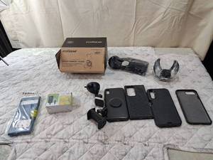 lot 44 image: Cell Phone Accessories Bundle with Cases, Car Mount and Charger