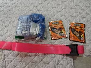 lot 53 image: Disposable Shoe Covers with HotHands Foot Warmers and pink gait belt