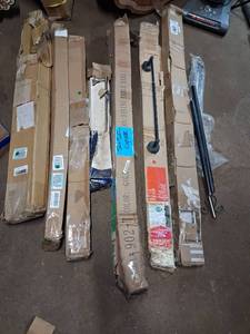 lot 75 image: Dining Room Furniture Table Base, random boxes with blinds, bathroom fixtures, towel rods, items as pictured