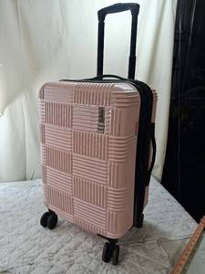 lot 85 image: Rose Gold Hard Shell Carry-On Suitcase with Spinner Wheels