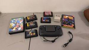 lot 1005 image: Sega handheld console with Sega 32X and Sega Genesis games