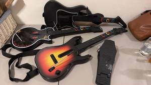 lot 1006 image: Play Station 2 and 3 Guitar Hero wireless guitar controllers and kick pedal