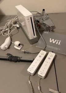 lot 1007 image: Wii game console with cords, controllers and motion sensor bar