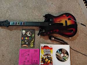 lot 1011 image: Wii Guitar Hero game, guitar, microphone and stickers