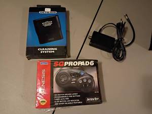 lot 1021 image: Sega Genesis SG ProPad6, Cleaning System and Cord