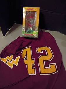 lot 1025 image: Washington Commanders Jersey and a Florida State Deion Sanders Bobble Head.  Sanders comes with COA