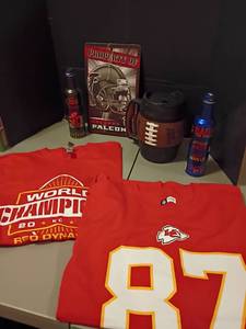 lot 1026 image: KC Chiefs T Shirts, size 2X, Souvenir Beer Cans, Football Mug and an Atlanta Falcons Sign