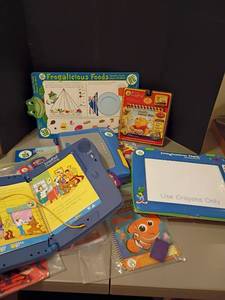 lot 1053 image: Leap Pads Plus Writing and Leap Pad Imagination Desk.  Plus lots of games