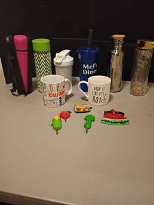lot 1111 image: Water Bottles, Refrigerator Magnets and Mugs