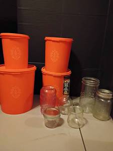 lot 1117 image: Vintage Tupperware Canister Set with Various Jars.  Largest canister has a cracked lid, but can be replaced by your nearest Tupperware Rep.