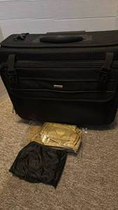 lot 1326 image: Black Rolling Travel Suitcase with Extendable Handle