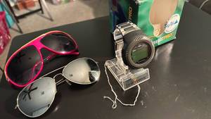 lot 1419 image: Sun glasses and beepwear pro watch