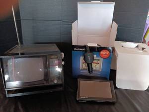 lot 2070 image: Portable TV and Garmin personal travel assistant