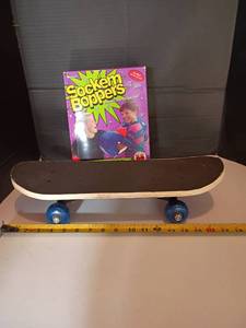 lot 2213 image: Small Skateboard and Sock em Boppers