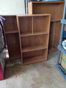 lot 2403 image: Bookshelves used in garage.  2 at 39 x 22 x 9.  The tallest is 48 x 30 x 12