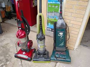 lot 2405 image: Various Vacuums.   All Need Repaired.  Most likely they need belts.