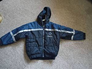 lot 1070 image: Dallas Cowboys NFL Coat.  Childs size 14-16.  Reversible. Zipper needs a pull put on