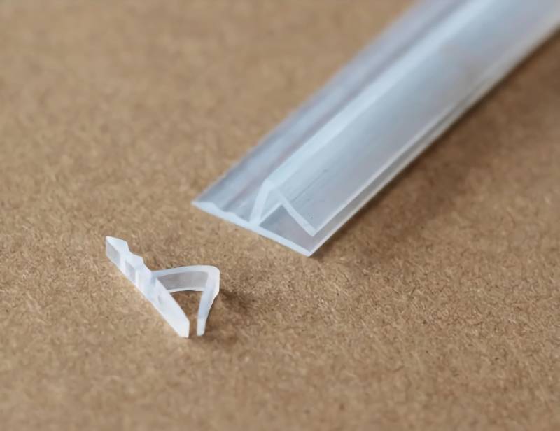 lot 56115 image: Shower Door Side Seal Strip - 120 - Inch Soft Silicone Frameless Side Seal Sweep to Stop Leaks Glass Door Seal Strip for a Tight, Waterproof Seal  Leak Guard H-Type 12 inch - Retail $13