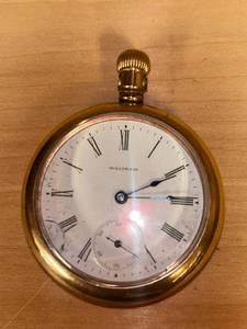 lot 16 image: Waltham  Pocket Watch with Roman Numerals, unsure of what it is made of