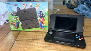 lot 44 image: Nintendo New 3DS Black Gaming Console with Original Box
