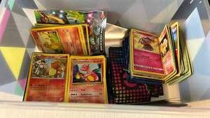 lot 106 image: Pokemon Trading Card Collection with Charmander and Other Cards