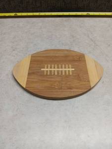 lot 211 image: Bamboo Football Shaped Cutting Board