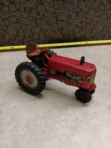 lot 236 image: Cast Iron Red Farm Tractor with Driver Figure - Figure is Headless
