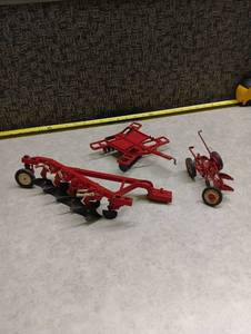 lot 238 image: Red Die-Cast Farm Implement Set - Plow, Disk Harrow & Small Plow 116 Scale