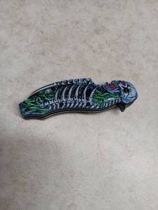 lot 276 image: Zombie Skeleton Folding Pocket Knife with Curved Blade