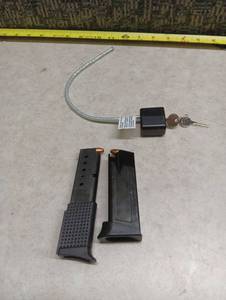 lot 294 image: Compact Pistol Magazines with Cable Lock - Mags have some 9mm Ammo