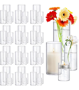 lot 19467 image: 48 Pack Thick Glass Cylinder Vases 4,6,9,12 Inch Tall Clear Flower Vase Hurricane Floating Candle Holder for Table Centerpiece Wedding Home Decor - Retail $129