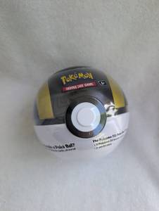 lot 601 image: Pokemon TCG Poke Ball Tin Container with Booster Packs- Sealed